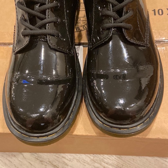 Dr Martens black patent leather ankle side zipper and lace up.  Size big…